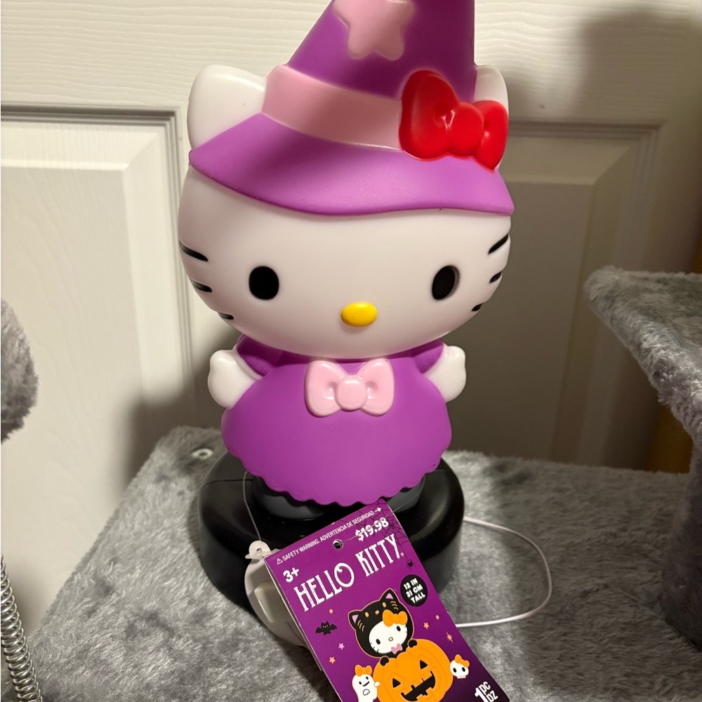 Hello Kitty Purple Witch Figurine with Red Bow
